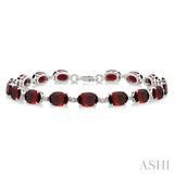 7X5 MM Oval Shape Garnet and 1/10 Ctw Single Cut Diamond Semi-Precious Bracelet in Sterling Silver