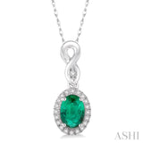 6x4 MM Oval Cut Emerald and 1/10 Ctw Round Cut Diamond Pendant in 14K White Gold with Chain