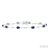 4x3 MM Oval Cut Sapphire and 1/3 Ctw Round Cut Diamond Precious Bar Bracelet in 10K White Gold