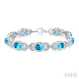 Blue Topaz and Diamond Bracelet in Sterling Silver