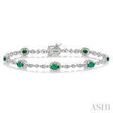 5x3 MM Oval Cut Emerald and 1/20 Ctw Round Cut Diamond Bracelet in 14K White Gold